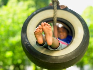 girl on swing outside